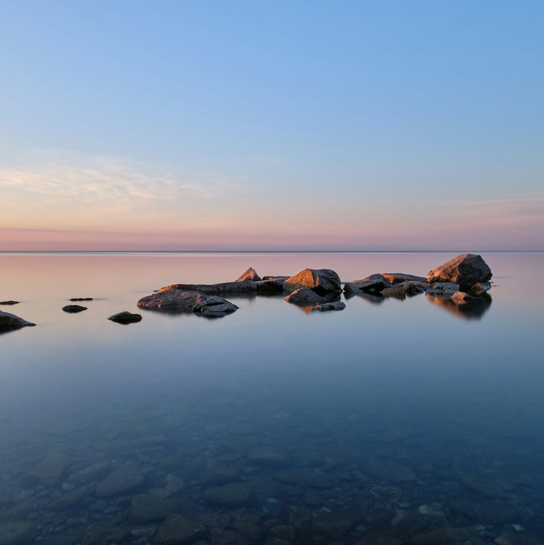 person meditating at sunrise