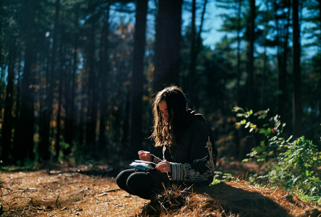 woman writing in journal