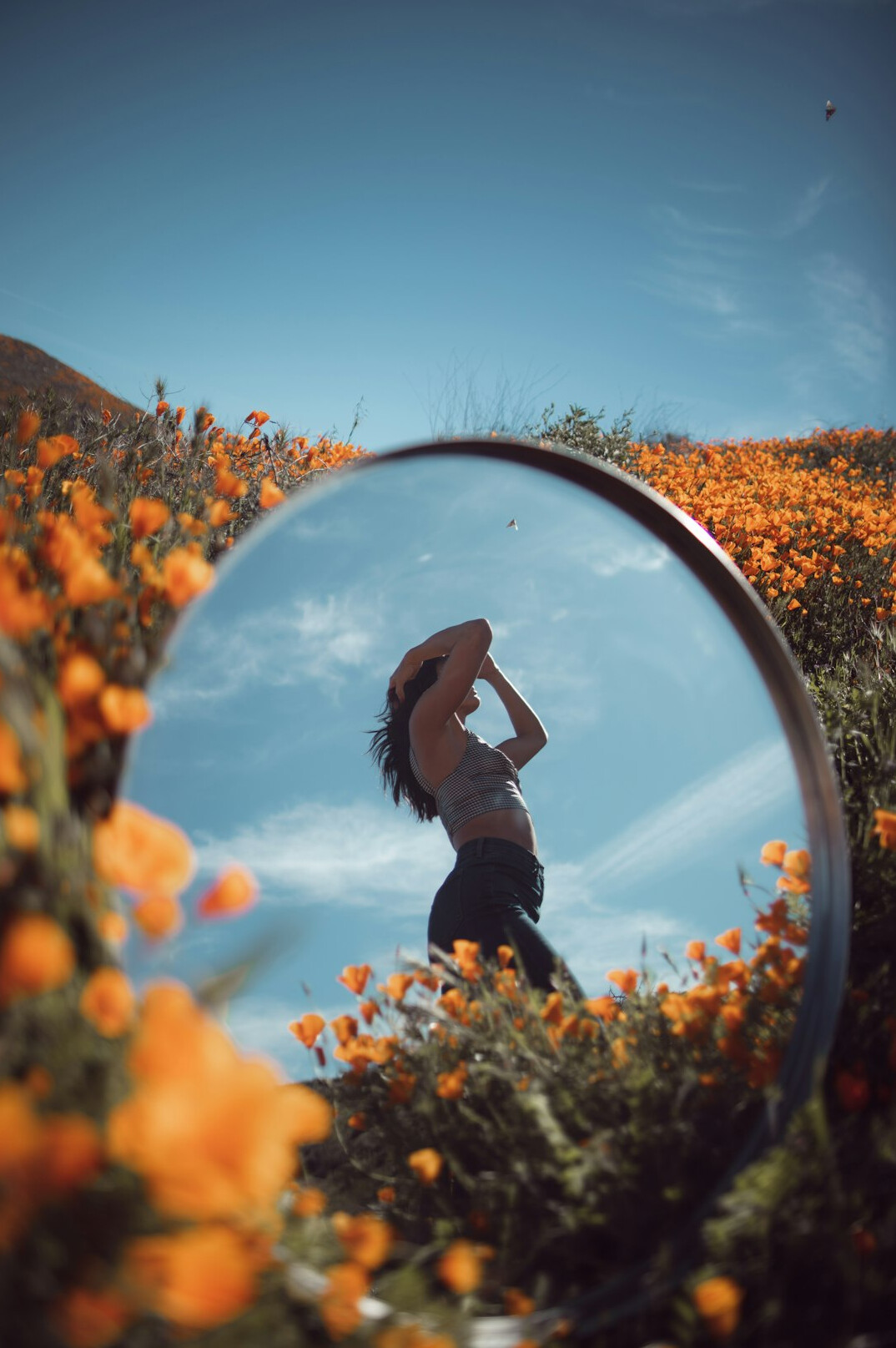 individual reflecting in mirror