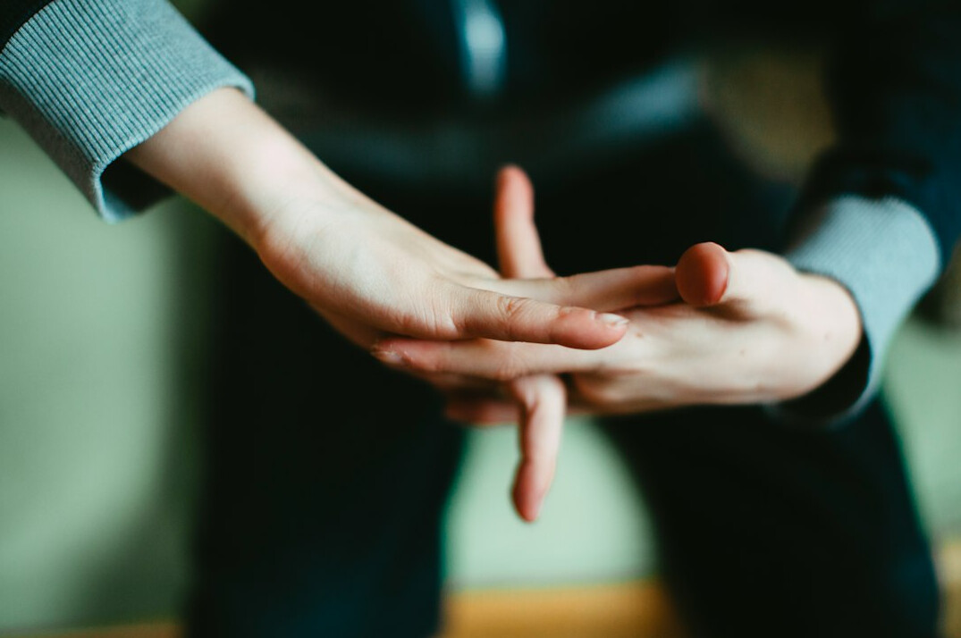 person using hand gestures while talking