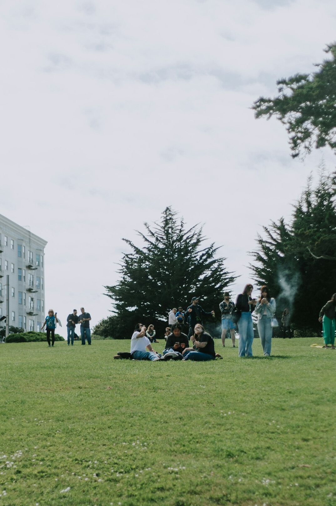 Small diverse group of people talking in a circle outdoors