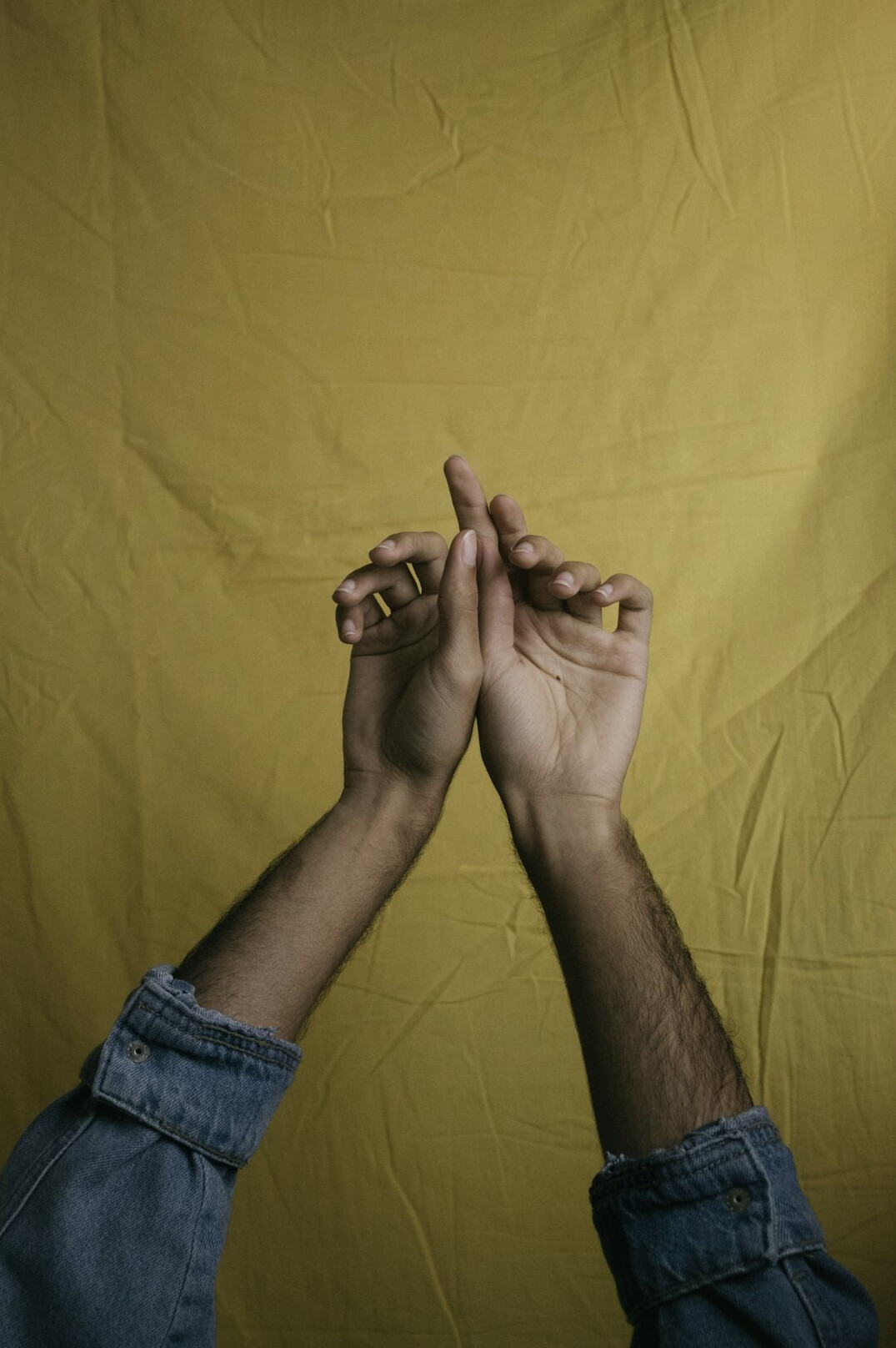 Close-up of two hands in a supportive handshake gesture